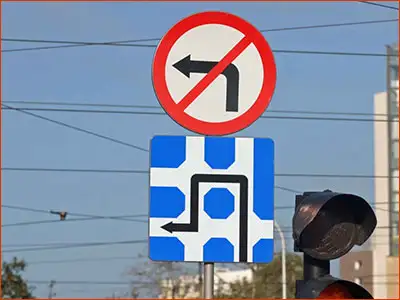 znak F-7 i B-21 tor jazdy dla chcącego skręcić w lewo